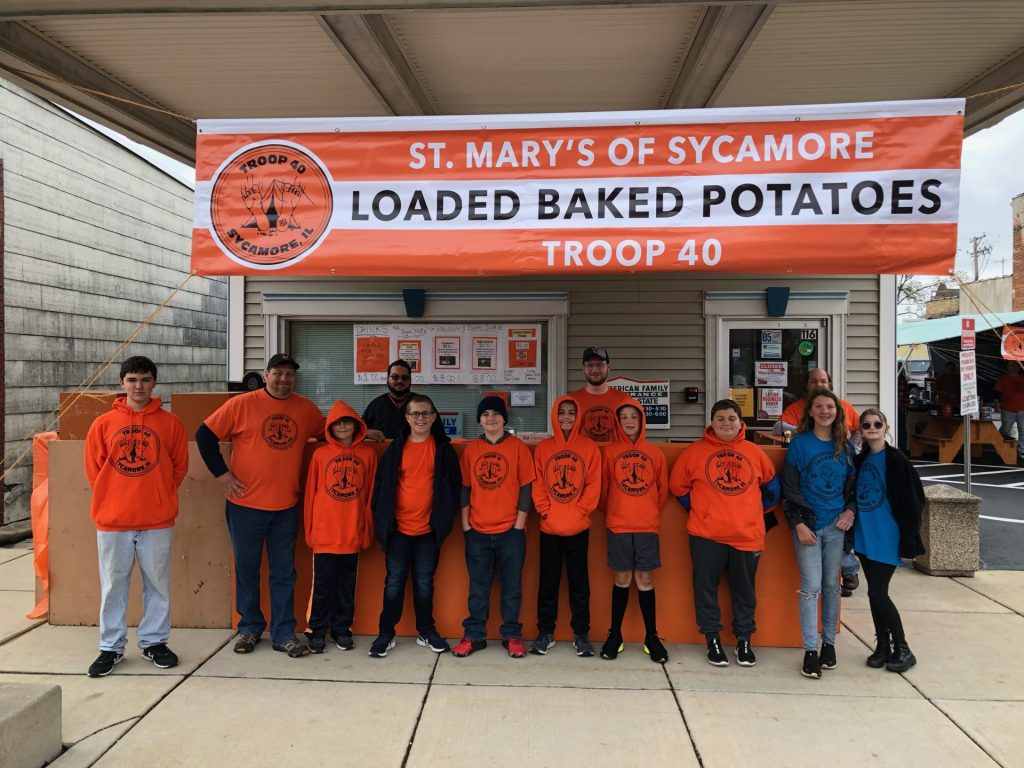 St. Mary's of Sycamore at Sycamore Pumpkin Festival selling loaded baked potatoes for patrons